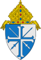 The arms of the Diocese of Lansing: The lances crossed per saltire are a play on the name of the see, the city of Lansing, Michigan.[7]