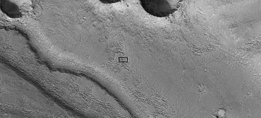 Close-up of channel within larger channel, as seen by HiRISE under HiWish program. The existence of the smaller channel suggests water went through the region at least two times in the past. The black box represents the size of a football field. Some parts of the surface would be difficult to walk on with the many small hills and depressions.