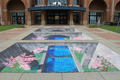 Interactive 3d sidewalk painting by Tracy Lee Stum at the Macon, Georgia's International Cherry Blossom Festival in front of the Georgia Sports Hall of Fame