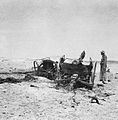 An RAF officer investigates wrecked Iraqi artillery near Habbaniya.