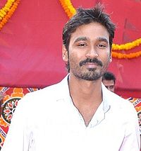 A picture of Dhanush as he looks at the camera