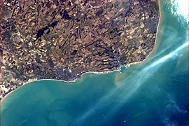 Folkestone and Dover from the International Space Station, showing the White Cliffs and the tracks of ferries.