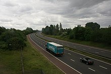 A curved, four-lane highway