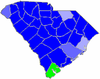 Blue counties were won by Thompson and green counties were won by McLane