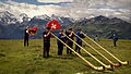 Image 5Some of the traditional symbols of Switzerland: the Swiss flag, the alphorn and the snow-capped Alps (from Culture of Switzerland)
