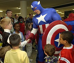 Captain America, foreground, and Spiderman greeted many Pentagon-assigned servicemembers and their children on April 28 for the unveiling of a custom comic book for members of the armed services.