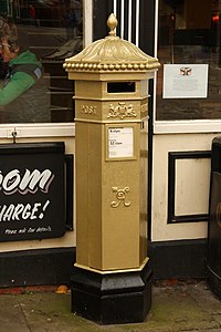 Gold postbox in Lincoln, painted in honour of the gold medal won by Sophie Wells