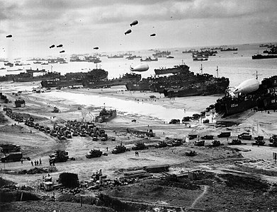 Landing ships putting cargo ashore on Omaha Beach at Operation Overlord, unknown author (edited by MIckStephenson)