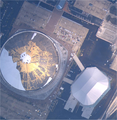 Satellite view of the Superdome showing the damaged roof with the New Orleans Arena to the right on August 30, 2005.