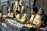 Talempong, a traditional percussion instrument from West Sumatra, consisting of a series of small gongs that are played by striking them with mallets.