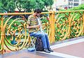 Street musician playing on the viaduct.