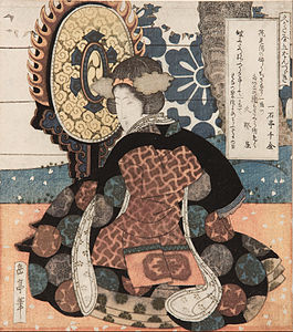 A woman playing a large suspended drum, at and by Yashima Gakutei