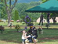 U.S. Army Soldier with his daughter at a military funeral.