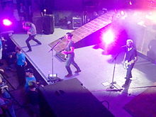 A rock band performing onstage