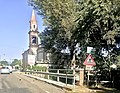 Campanile di San Maurizio visto dal ponte sul torrente Rodano