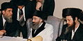 The present Zvhil-Mezhbizh Rebbe, Grand Rabbi Yitzhak Aharon Korff of Boston, Center, with cousins the late Tolner Rebbe (left), Rabbi Yitzhak Twersky of Boston, and the Grand Rabbi Shlomo Goldman, Zvhiller Rebbe of Union City