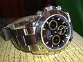 Model number 116520 stainless steel black dial Rolex Daytona.