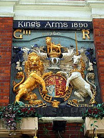 A relief of the Hanoverian Royal Arms from a gateway over the old London Bridge now forms part of the façade of the King's Arms pub, Southwark