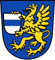 Gemeinde Bruckberg In Blau ein gekrönter goldener Greif, der in seinen Fängen einen silbernen Schild mit blauem Balken hält.