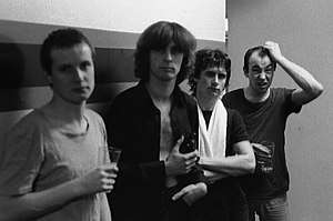 XTC standing in a row in a black-and-white photo