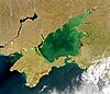 Satellite image of Azov Sea showing distinct change in colour between the dark blue Black Sea and the light green Azov Sea