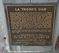 Plaque detailing history of Johnstone Park and LaTrobe Dam.