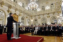 Macri speaking to an audience from a podium