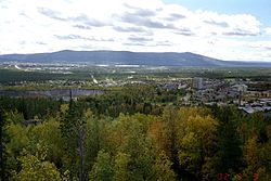 Malmberget. "The Pit" is visible in the centre-left of the image. In the background Gällivare and the Dundret mountain.