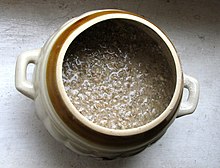 A ceramic pot filled with rye meal mixed with water