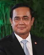 Smiling Thai man in suit