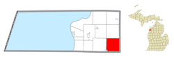 Location within Benzie County (red) and an administered portion of the Thompsonville village (pink)