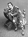 The American actor Edwin Booth as Hamlet, seated in a curule chair, c. 1870