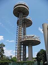 The observation towers in 2009. There are three towers of varying height, all of which are abandoned. There is a scaffold next to the tallest tower.