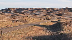 A photograph of a prairie roadside in Sand Hills, Nebraska