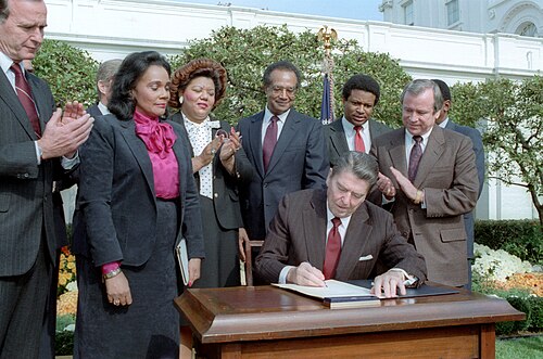 President Reagan signs the bill making Martin Luther King, Jr.'s birthday a national holiday..