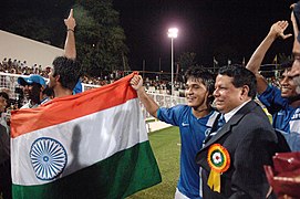 Priyaranjan Dasmunsi and the footballer, Sunil Chetri along with other players celebrating after winning the final