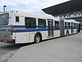 An articulated bus at Production Way-University Station.