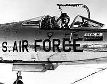 Chuck Yeager waving to the camera from the cockpit of his NF-104