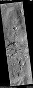 Channel cutting across trough, as seen by HiRISE under HiWish program. The trough and channel are labeled.