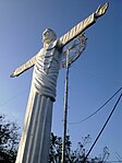 Risen Christ statue atop the Tombol Hill