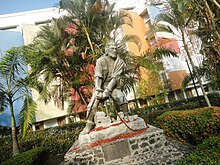 Outdoor statue of a man struggling against his chains