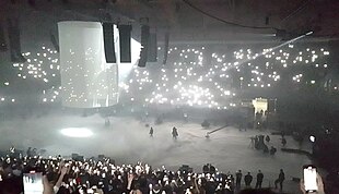 Listening party showing the stage with a wall above