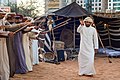 Image 4A band performs the Ayyala, which is a cultural dance derived from Arab tribes sword battles. (from Culture of the United Arab Emirates)