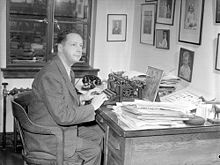 Foster Hewitt sitting at his office desk.