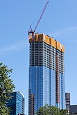 Construction in September 2015 showing concrete skeleton and curtain wall going up.