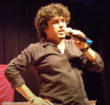 Kharel singing in the US during Dashai Tihar Mela concert