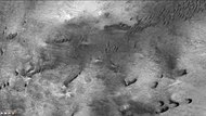 Dunes in Liu Hsin Crater, as seen by CTX camera (on Mars Reconnaissance Orbiter). Dark lines are dust devil tracks. Note: this is an enlargement of a previous image of Liu Sin Crater.