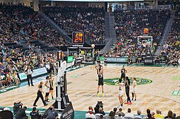 View of an ongoing WNBA game with a Seattle Storm player taking a free throw while other players and spectators watch; the shot clock reads "24 seconds".