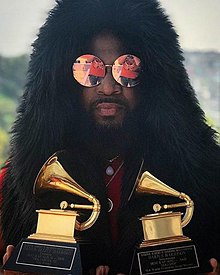 Deezle poses with his 2009 Grammys for Best Rap Song and Best Rap Album