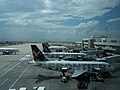 Frontier Airlines planes at Denver International Airport. All Frontier planes have a different animal painted on the tail.